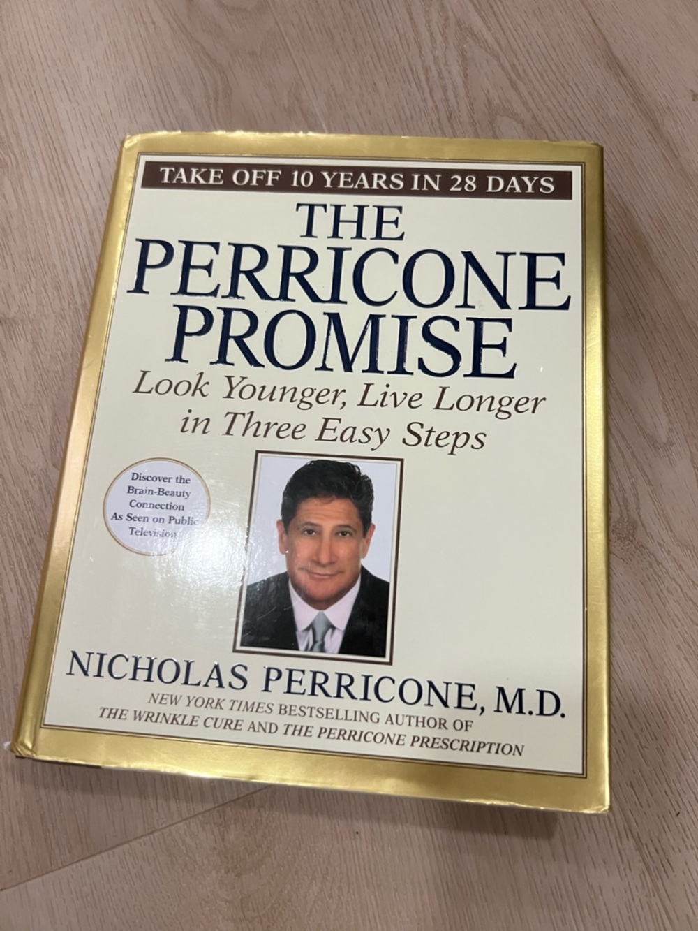 The Perricone Promise by Nicholas Perricone M.D. - Cream & Gold Hardcover